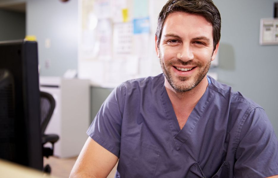 Male nurse smiling at camera